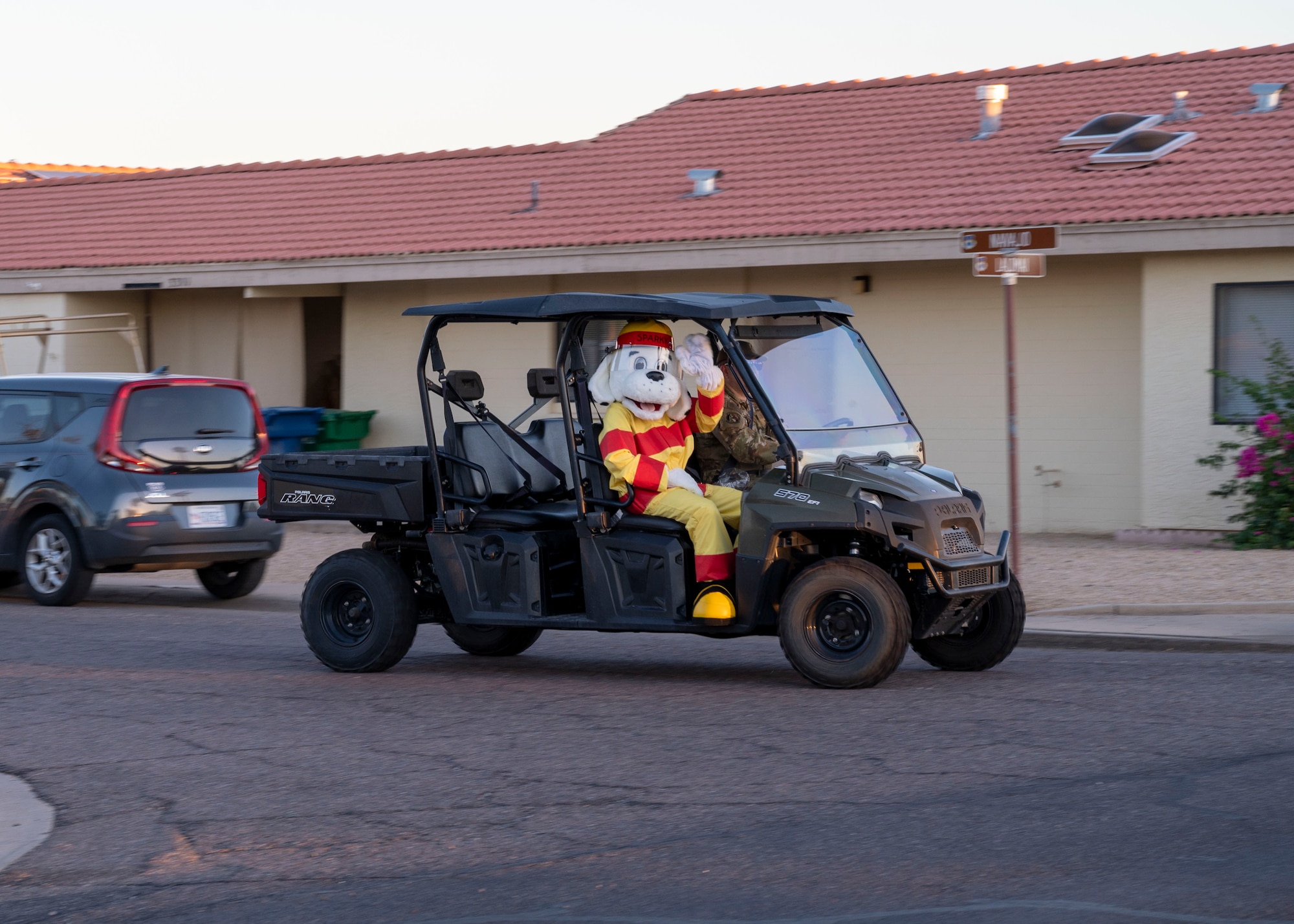 “Sparky”, 56th Civil Engineer Squadron Fire Department mascot, joins the parade through base housing Oct. 13, 2022, at Luke Air Force Base, Arizona.