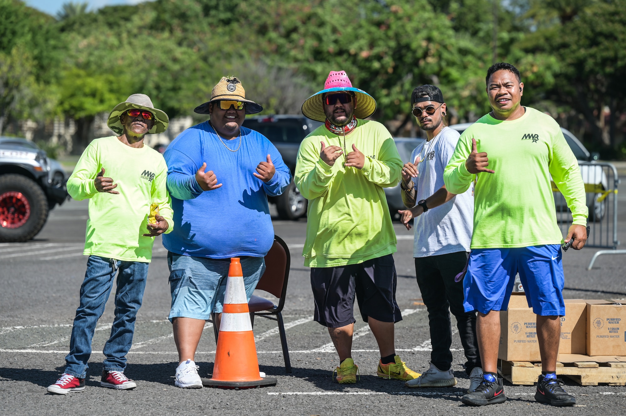 Morale, Welfare, and Recreation volunteers distribute water to military housing residents on Joint Base Pearl Harbor-Hickam, Hawaii, Oct. 21, 2022. Water distribution sites were postured at the Navy Exchange and Hickam Exchange parking lots due to a major water line break on Oct. 14, 2022, that affected JBPHH. (U.S. Air Force photo by Staff Sgt. Alan Ricker)