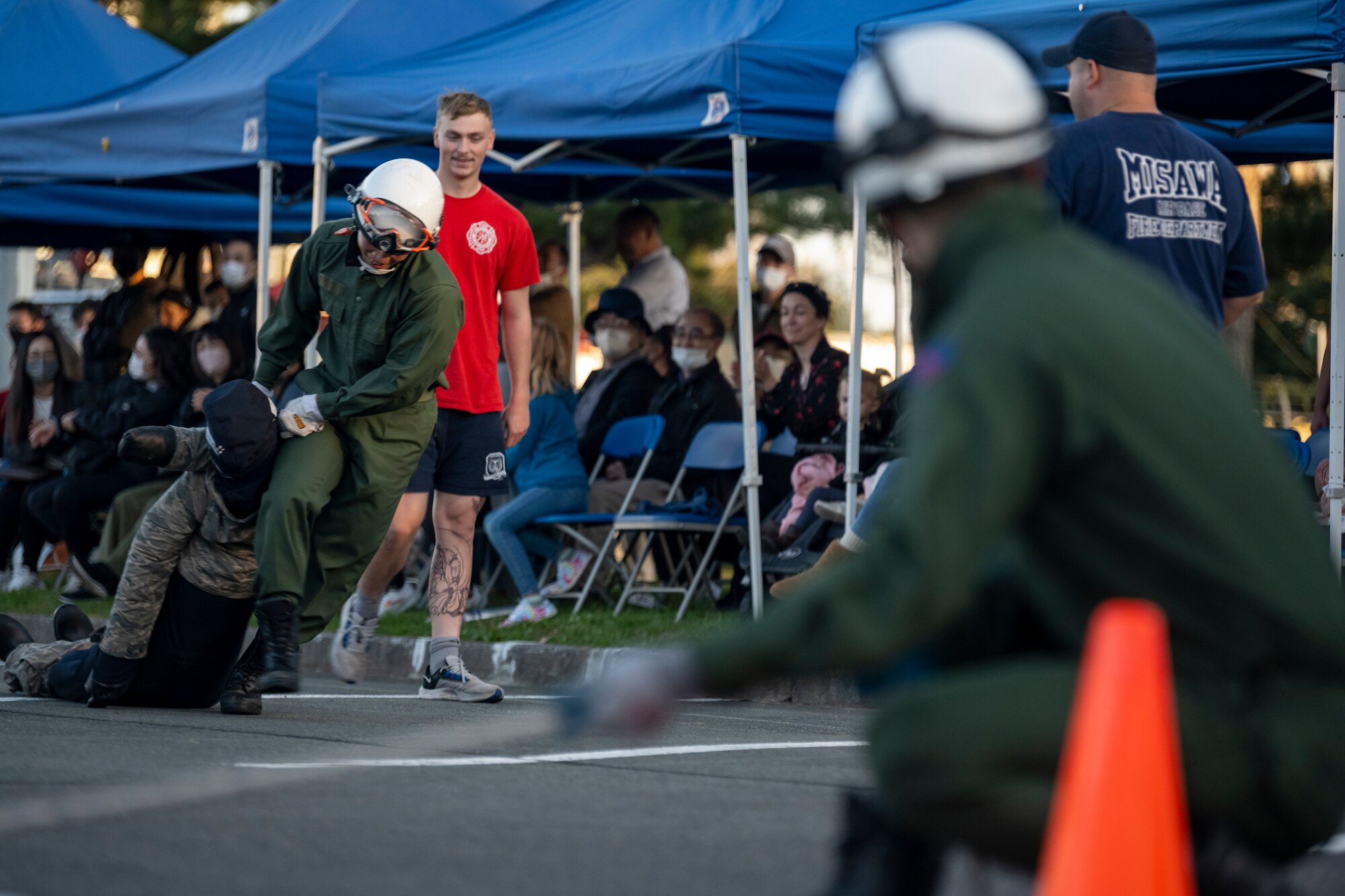 Competitor pulling a dummy during the annual Fire Muster during Fire Prevention Week.