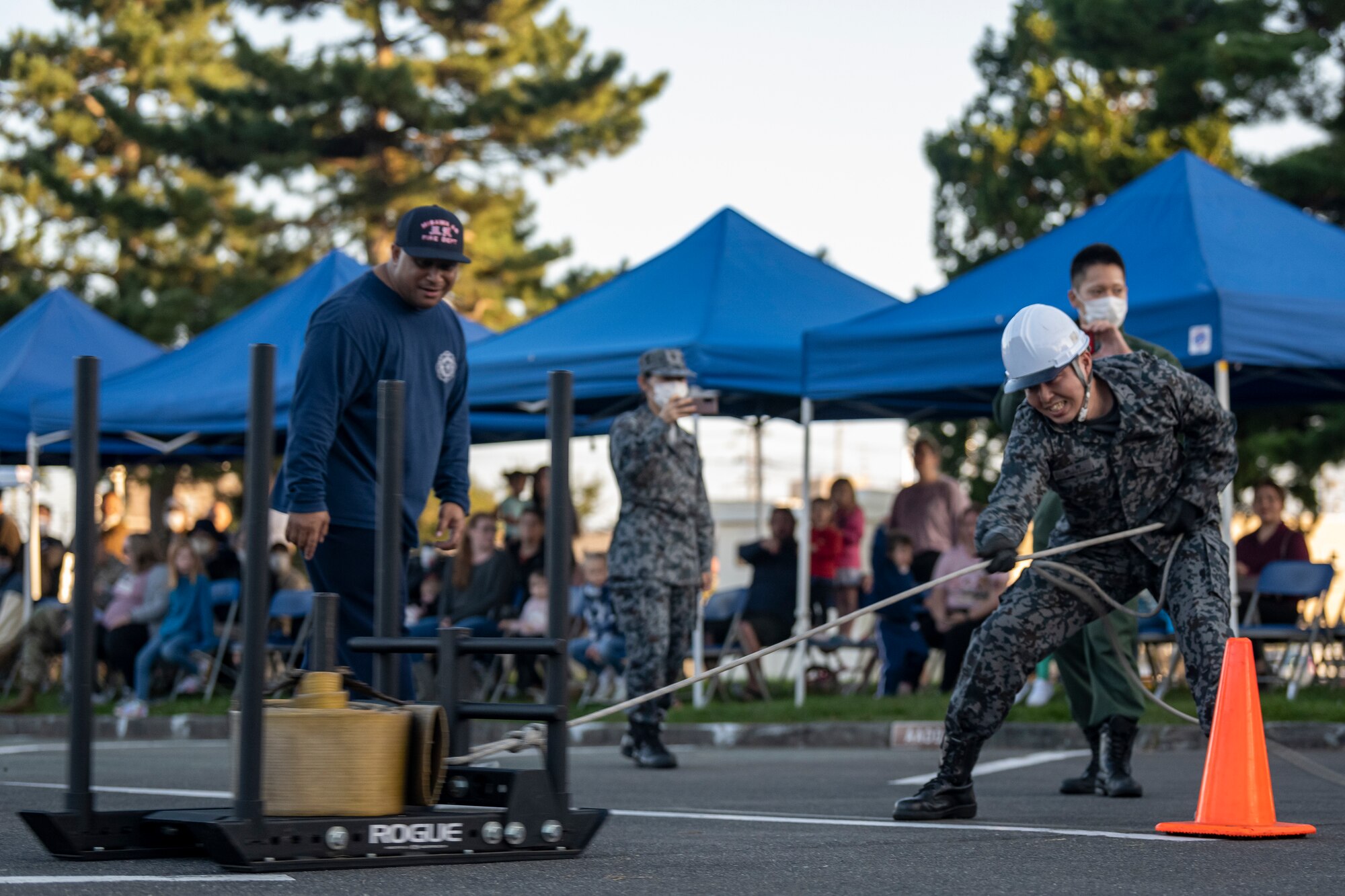 Competitor pulling a sled during the Fire Muster during Fire Prevention Week.