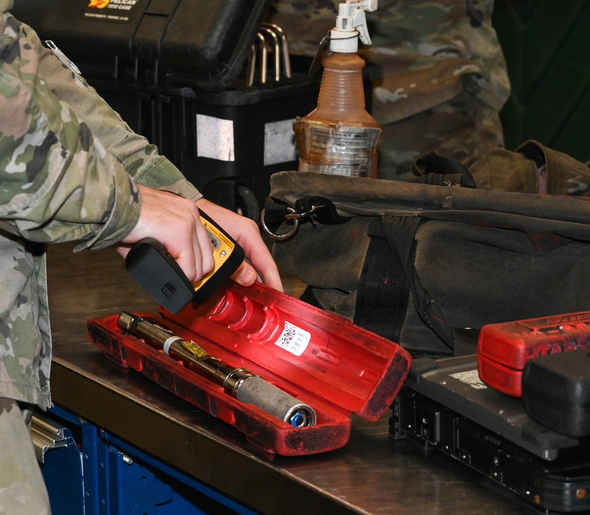 U.S. Air Force Senior Airman William Farrell, 509th Sortie Support, composite tool kit technician receives tools to turn it at Whiteman Air Force Base, Missouri, October 12, 2022. Support provides services such as checking in and checking out tools. (U.S. Air Force photo by Airman 1st Class Hailey Farrell)