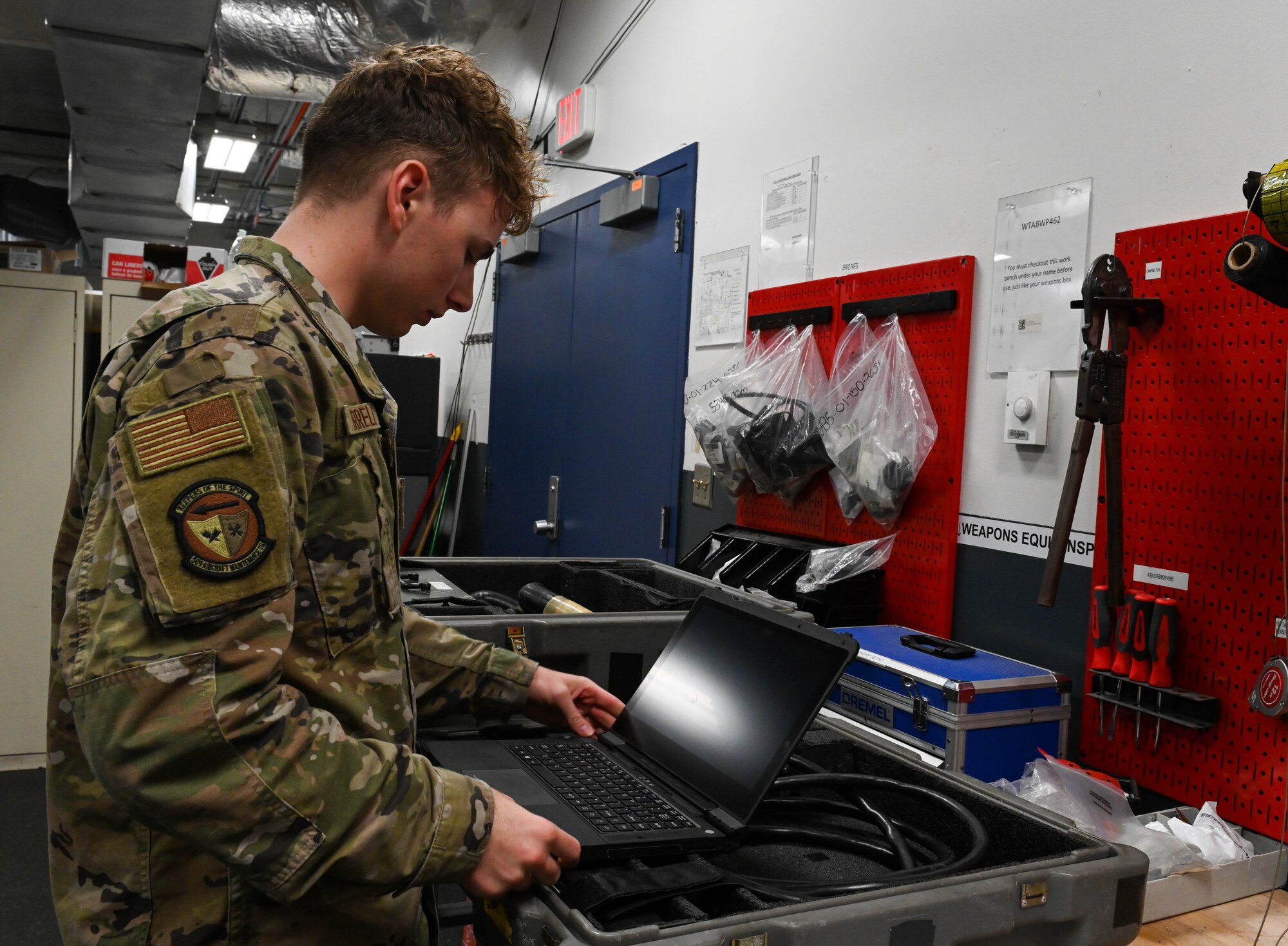 U.S. Air Force Senior Airman William Farrell, 509th Sortie Support section, composite tool kit technician inspects equipment at Whiteman Air Force Base, Missouri, October 12, 2022. Support ensures the agencies on the flight line have what they need to get their job done correctly and efficiently to meet the mission requirements. (U.S. Air Force photo by Airman 1st Class Hailey Farrell)