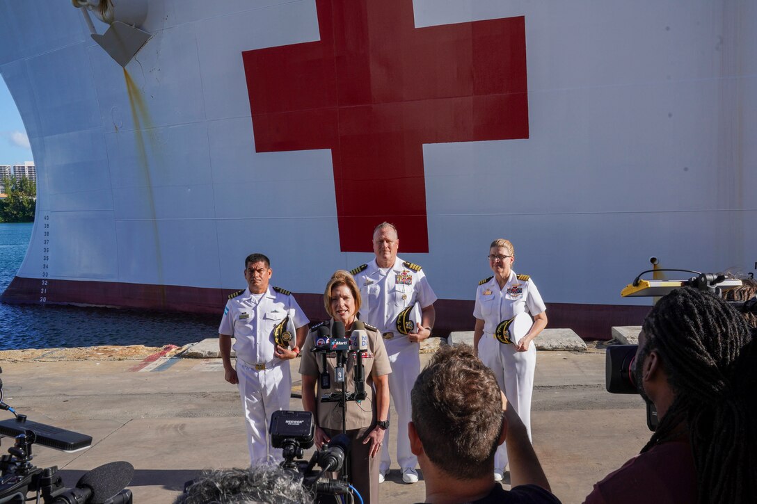 Army Gen. Laura Richardson, commander of U.S. Southern Command, speaks to media representatives in front of hospital ship USNS Comfort.