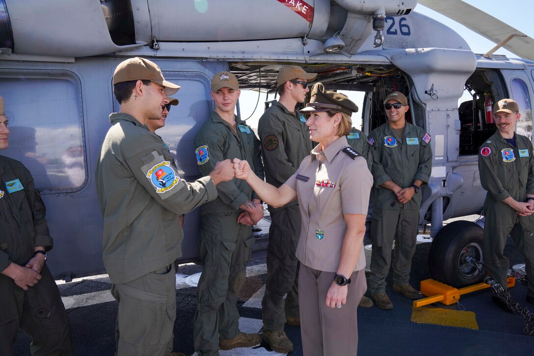 Army Gen. Laura Richardson, commander of U.S. Southern Command, greets crew members of hospital ship USNS Comfort.