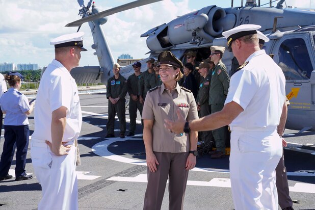 Army Gen. Laura Richardson, commander of U.S. Southern Command, speaks with crew members of hospital ship USNS Comfort .