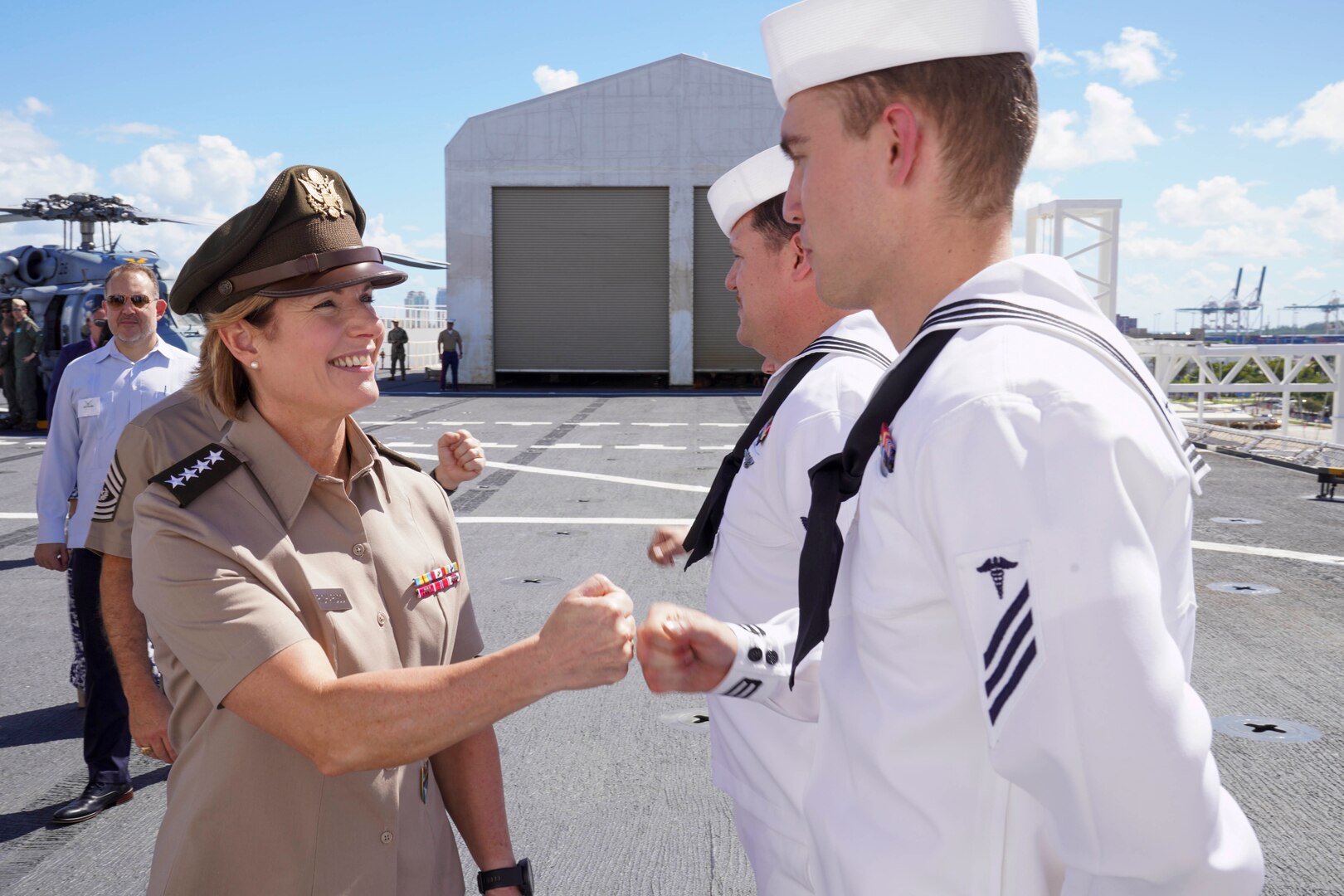 Army Gen. Laura Richardson, commander of U.S. Southern Command, greets crew members of hospital ship USNS Comfort.