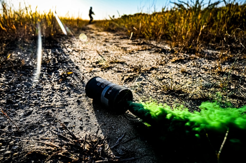 U.S. Army Soldiers assigned to the 113th Infantry Regiment conduct a platoon attack drill and employ a green smoke grenade at Joint Base McGuire-Dix-Lakehurst, N.J. on Oct. 15, 2022. During the drill the platoon lead squad locates and suppresses the enemy, establishes supporting fire, and assaults the enemy position using fire and maneuver. The platoon destroys or causes the enemy to withdraw and conducts consolidation and reorganization thereafter. Once the platoon conducts action on enemy contact, the squad or section in contact reacts to contact by immediately returning well-aimed fire on known enemy positions. Dismounted Soldiers assume the nearest covered positions available and the element in contact attempts to achieve suppressive fires. Once achieved, the element leader notifies the platoon leader of the action.