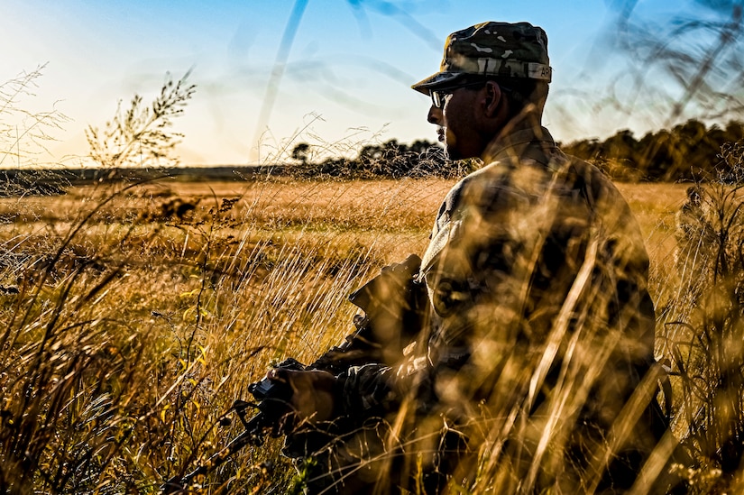 A U.S. Army Soldier assigned to the 113th Infantry Regiment conducts a platoon attack drill at Joint Base McGuire-Dix-Lakehurst, N.J. on Oct. 15, 2022. During the drill the platoon lead squad locates and suppresses the enemy, establishes supporting fire, and assaults the enemy position using fire and maneuver. The platoon destroys or causes the enemy to withdraw and conducts consolidation and reorganization thereafter. Once the platoon conducts action on enemy contact, the squad or section in contact reacts to contact by immediately returning well-aimed fire on known enemy positions. Dismounted Soldiers assume the nearest covered positions available and the element in contact attempts to achieve suppressive fires. Once achieved, the element leader notifies the platoon leader of the action.