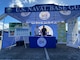 NAVAL BASE GUAM (Oct. 3, 2022) - Robert "Top" Ellsworth, U.S. Naval Base Guam (NBG) emergency management (EM) officer, and Clint Cruz, NBG emergency operations center manager, set-up an informational booth at the Dededo Farmer’s Market Sept. 30 as part of National Preparedness Month (NPM) finale event.