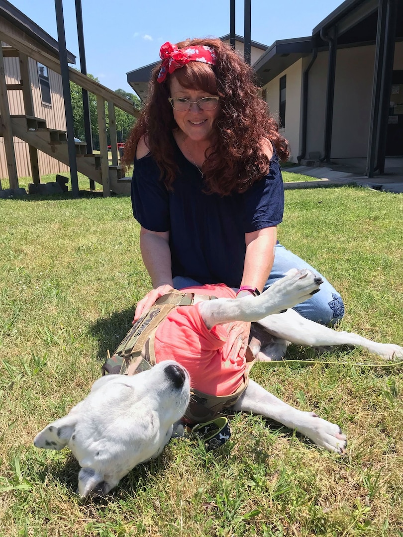 Chaplain (Lt. Col.) Heather Simon plays with her support dog Oreo in North Little Rock, Ark., May 19, 2019. Simon and Chaplain (Lt. Col.) Martha Kester on Oct. 1, 2022, became the first women to serve as state chaplains in their states and in the country — Kester will serve the Iowa National Guard, while Simon will serve the New Jersey National Guard.