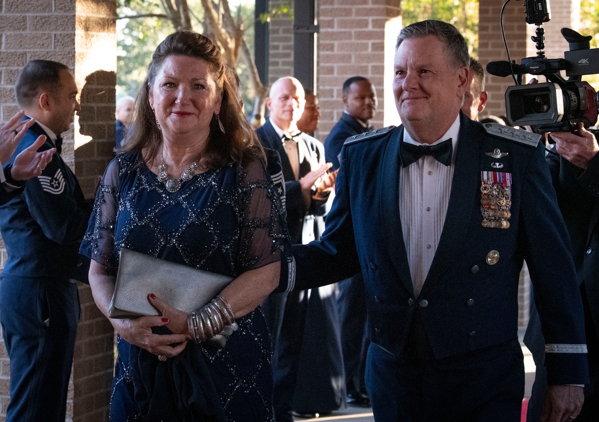 U.S. Air Force retired Lt. Gen. Marshall B. Webb, former Air Force Special Operations Command commander and Air Education and Training Command commander, and wife, Dawna, are greeted during an Order of the Sword ceremony at Keesler Air Force Base, Mississippi, Oct. 15, 2022.