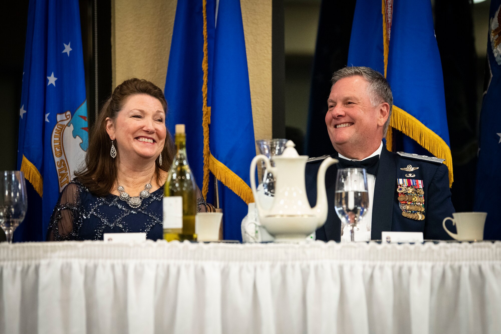 U.S. Air Force retired Lt. Gen. Marshall B. Webb, former Air Force Special Operations Command commander and Air Education and Training Command commander, and wife, Dawna, laugh at a speech given during an Order of the Sword ceremony in his honor at Keesler Air Force Base, Mississippi, Oct. 15, 2022.