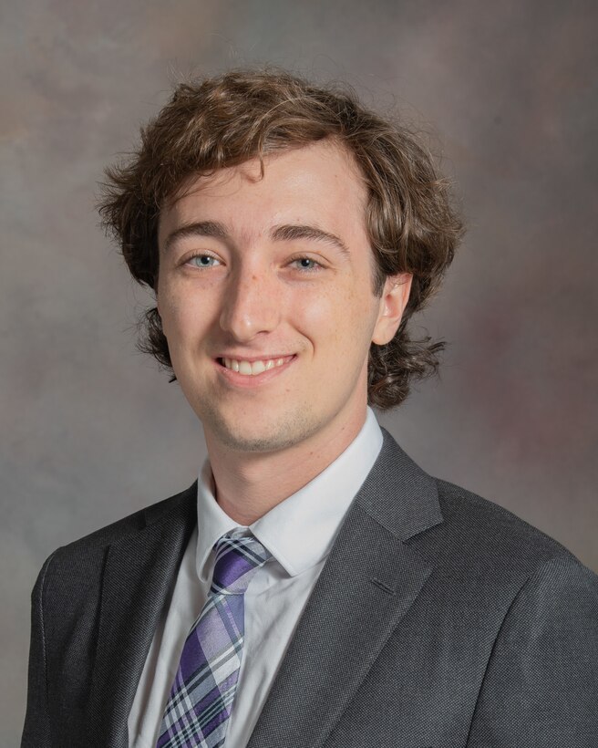 Headshot photo of young, male NDU employee.