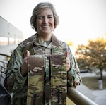 Lt. Col. Martha Kester smiles after completing a Passing of the Stole Ceremony at Joint Force Headquarters in Johnston, Iowa, Oct. 22, 2022. Kester and Lt. Col. Heather Simon are the first women state chaplains — Kester will serve the Iowa National Guard, while Simon will serve the New Jersey National Guard.