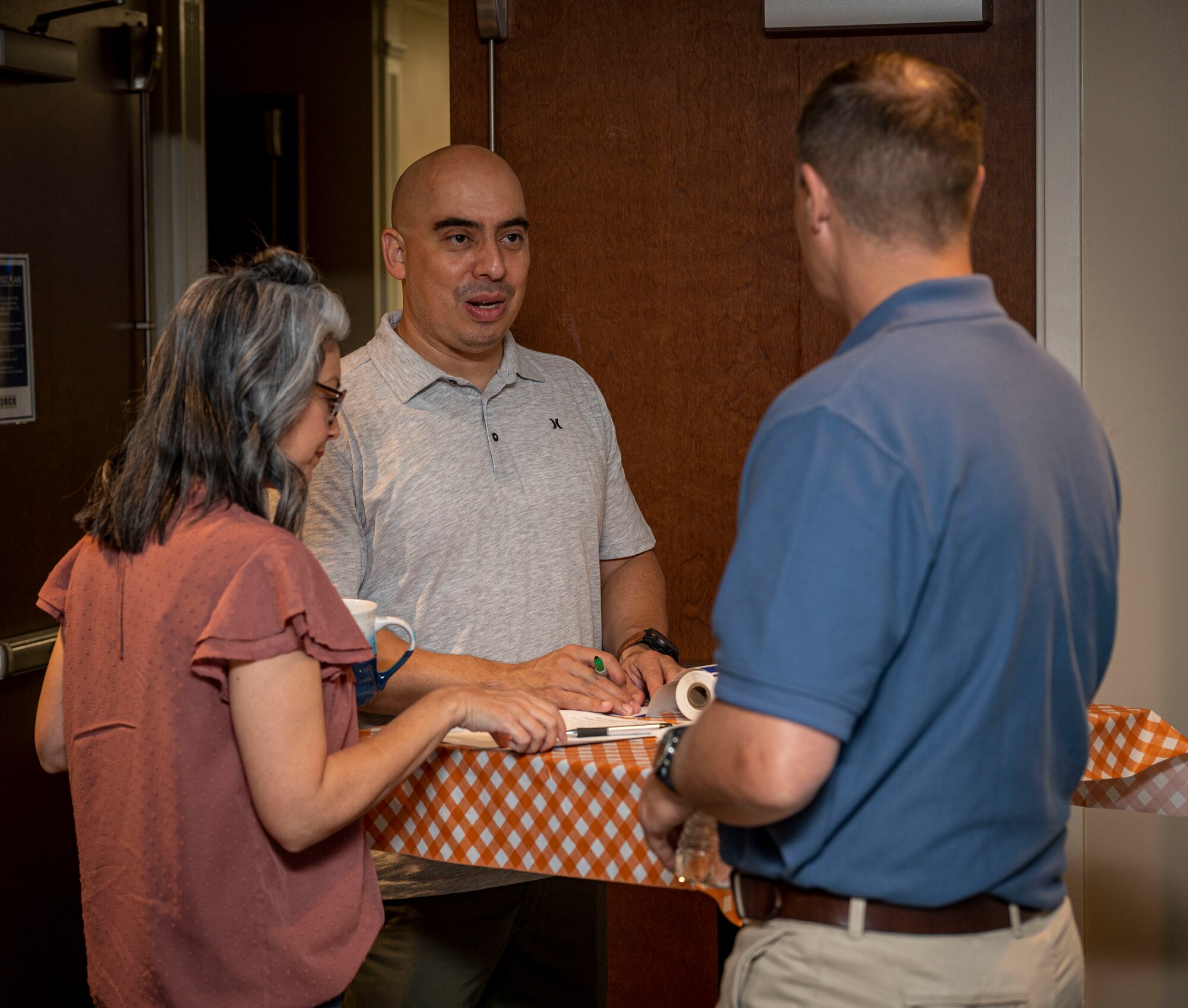 Col. Lucas Teel, 4th Fighter Wing commander, speaks with Chief Master Sgt. Peter Martinez, 4th FW command chief, during key spouses brunch at Seymour Johnson Air Force Base, North Carolina, Oct. 22, 2022. The Key Spouse Program was established to enhance family readiness, strengthen personal and family resilience and foster a sense of community. (U.S. Air Force photo by Airman 1st Class Sabrina Fuller)
