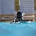 Sgt. Maurice Manns II with the 204th Maneuver  Enhancement Brigade, emerges for a breath during the swimming portion of the German Armed Forces Proficiency Badge , conducted at Camp Williams, Utah Oct. 16, 2022. This year’s competition offers an opportunity for competitors to earn the German Armed Forces Proficiency Badge. The Utah National Guard Best Warrior Competition is an annual event that brings together Soldiers and Airmen from the major commands to compete for the title of Soldier/Airman-of-the-Year, Noncommissioned Officer-of-the-Year and Senior NCO-of-the-Year. The Army winners of this competition will represent the Utah Army National Guard at the Region VII Best Warrior Competition next spring.  (U.S. Army National Guard photo by Staff Sgt. Ariel J. Solomon)