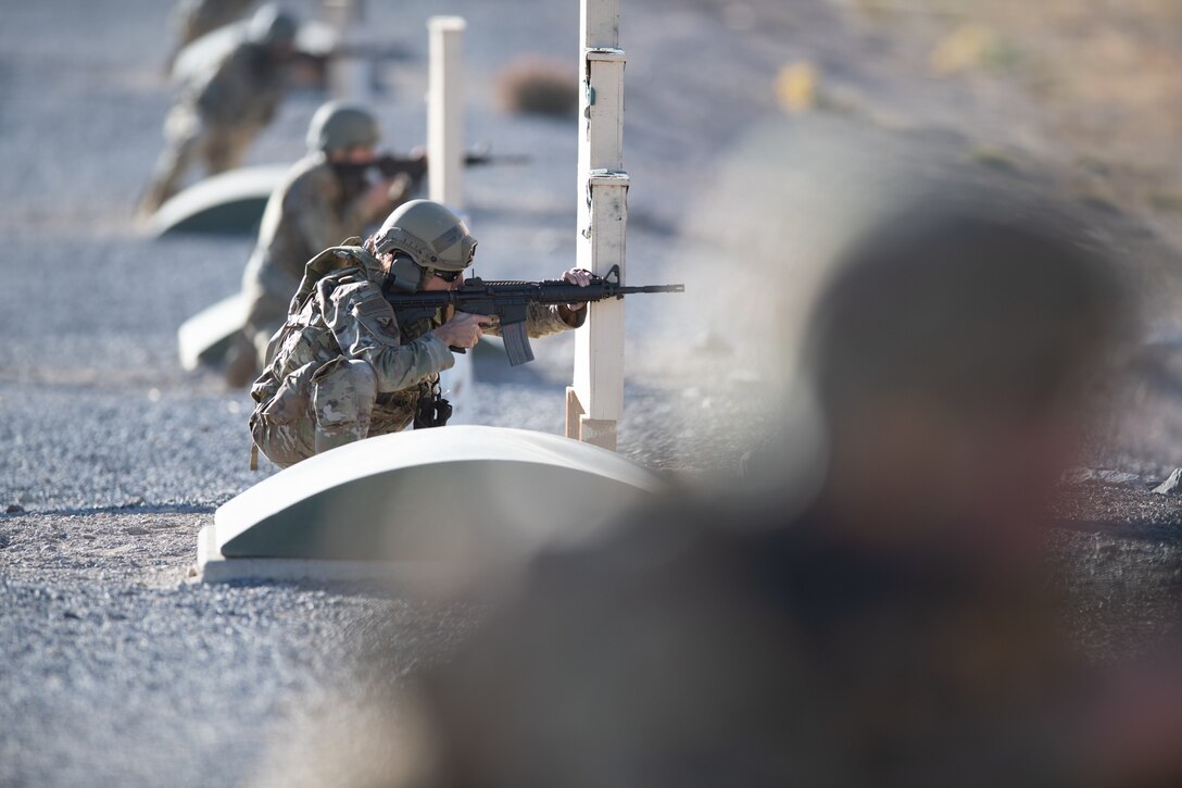 Tech Sgt. Kelly Sessions with the Utah Air National Guard engages targets during the Army rifle qualification as part of the Utah National Guard Best Warrior Competition at Camp Williams, Utah, Oct. 17, 2022.