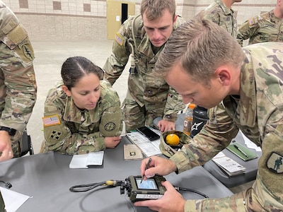 Utah Army National Guard Staff Sgt. Andrea Chica of 97th Aviation Troop Command,  learns how to use a SINCGARS radio as part of theUtah National Guard Best Warrior Competition,Oct. 16, 2022, at Camp Williams, Utah.