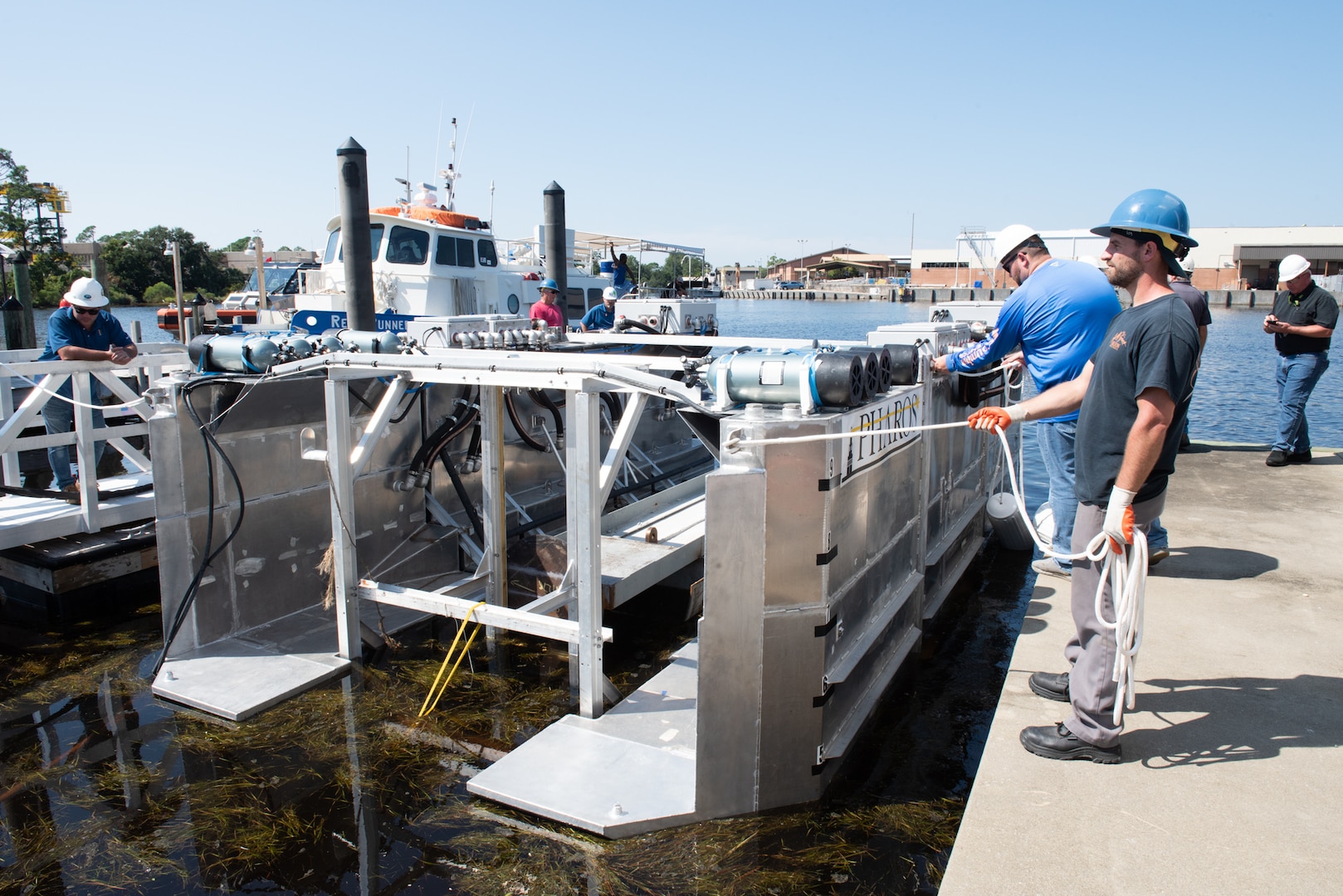 HII’s Pharos receives final preparation before launching into the water as the system needed to ensure it was capable of ballasting and de-ballasting in a loaded condition and also demonstrate its capability to be recovered from a large boat ramp at Naval Support Activity (NSA) Panama City, Fla., Sept. 1. Naval Surface Warfare Center Panama City Division’s Unmanned Systems Test and Evaluation Team along with support from NSA Panama City and U. S. Coast Guard Station Panama City, combined efforts to help the successful launch and recovery testing. (U.S. Navy photo by Ronnie Newsome)