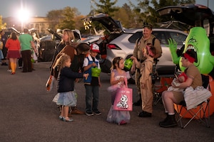Young kids trick-or-treat.
