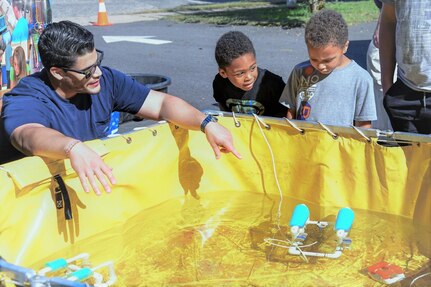 IMAGE: On Oct. 14, Naval Surface Warfare Center Dahlgren Division hosted its very first Dahlgren Downtown event at The Old Silk Mill in Downtown Fredericksburg. In addition to the science, technology, engineering and math displays, community members were able to view a number of Dahlgren historical artifacts.