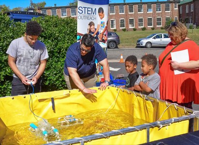 IMAGE: On Oct. 14, Naval Surface Warfare Center Dahlgren Division hosted its very first Dahlgren Downtown event at The Old Silk Mill in Downtown Fredericksburg. In addition to the science, technology, engineering and math displays, community members were able to view a number of Dahlgren historical artifacts.