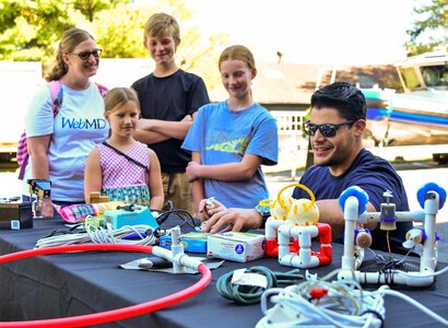 IMAGE: On Oct. 14, Naval Surface Warfare Center Dahlgren Division hosted its very first Dahlgren Downtown event at The Old Silk Mill in Downtown Fredericksburg. In addition to the science, technology, engineering and math displays, community members were able to view a number of Dahlgren historical artifacts.