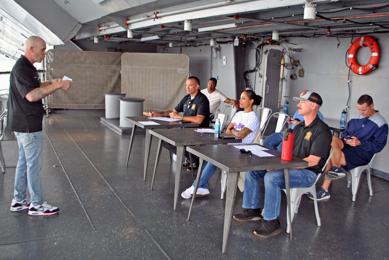 Navy Chief Petty Officer Eugene Nixdorf (San Antonio MEPS) gives a presentation aboard the USS Midway in San Diego. Nixdorf was one of five winners selected for USMEPCOM Military Member of the Year.