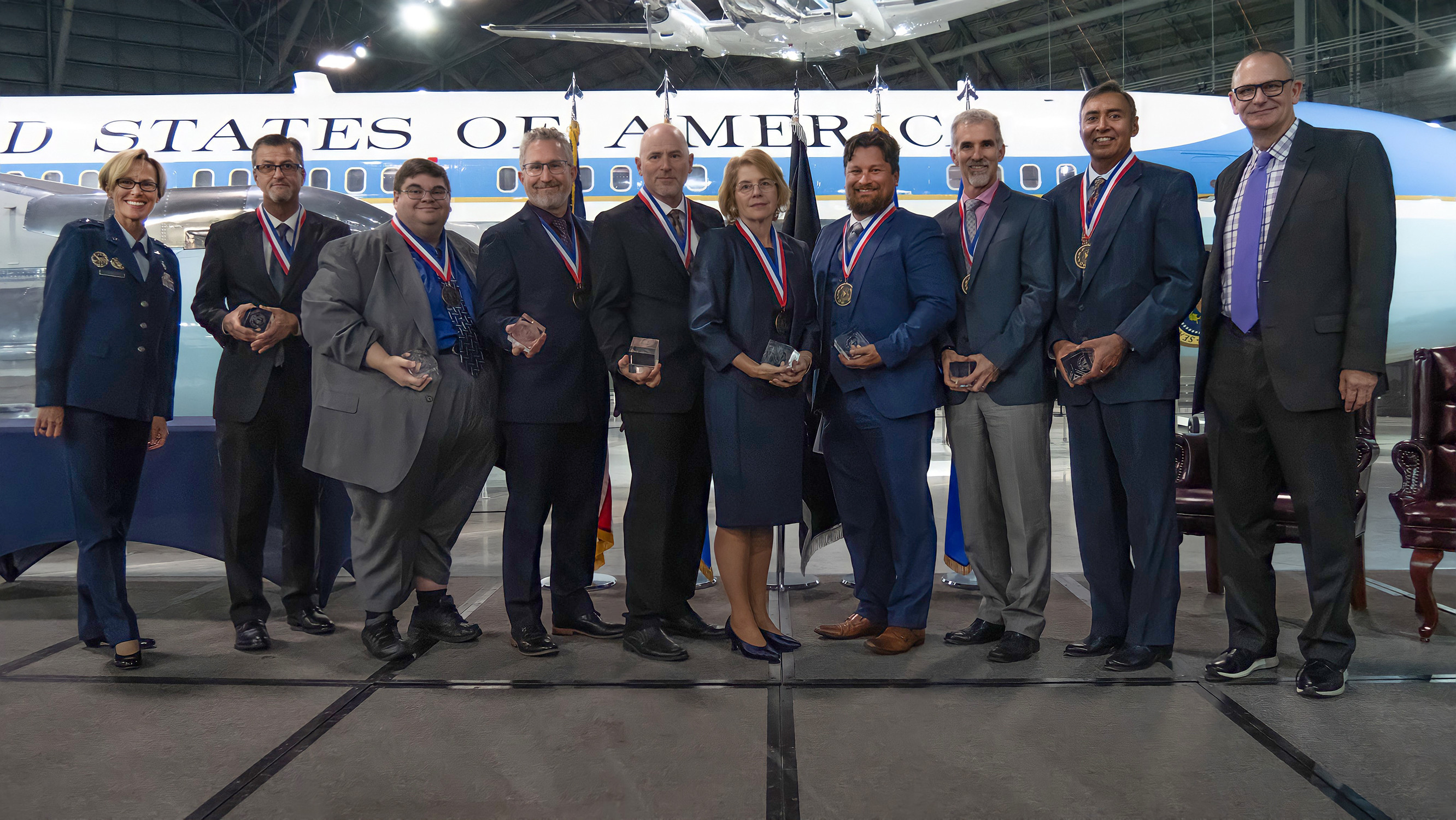 Air Force Research Laboratory Commander Maj. Gen. Heather Pringle, far left, and Chief Technology Officer Dr. Tim Bunning, far right, pose with the 2022 Fellows, from left to right, Dr. Joseph Mabry, Dr. Jason Parker, Dr. David Mollenhauer, Mr. John Brausch, Dr. Tamara Chelette, Dr. Richard “Andy” McKinley, Dr. Greg Reich and Dr. Ashwani Sharma at the National Museum of the U.S. Air Force, Oct. 12, 2022, during the 2022 AFRL Fellows and Early Career Awards ceremony. The Air Force Research Laboratory honored scientists and engineers for outstanding career accomplishments during the annual event. One 2022 Fellow, Dr. Dale Ferguson, is not pictured. (U.S. Air Force photo / Keith Lewis)