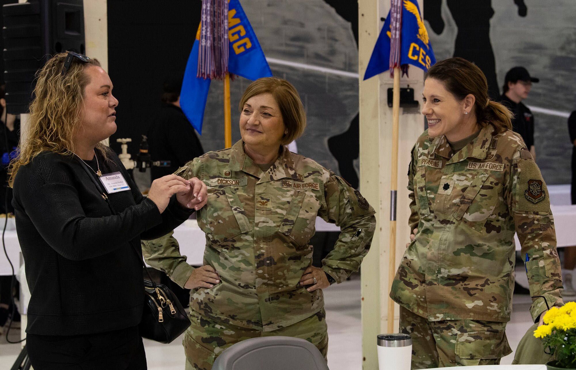 Amanda Perdue, left, Delaware Breast Cancer Coalition program manager, chats with Col. Peggy Dickson, 436th Medical Group commander, and Lt. Col. Sara Spearing, right, 436th Health Care Operations Squadron commander, prior to the 2023 Honorary Commanders Induction Ceremony at Dover Air Force Base, Delaware, Oct. 20, 2022. Perdue, along with forty-one other local civic and business leaders were inducted into the HCC program. She will serve as the HCC for the 436th MDG. (U.S. Air Force photo by Roland Balik)