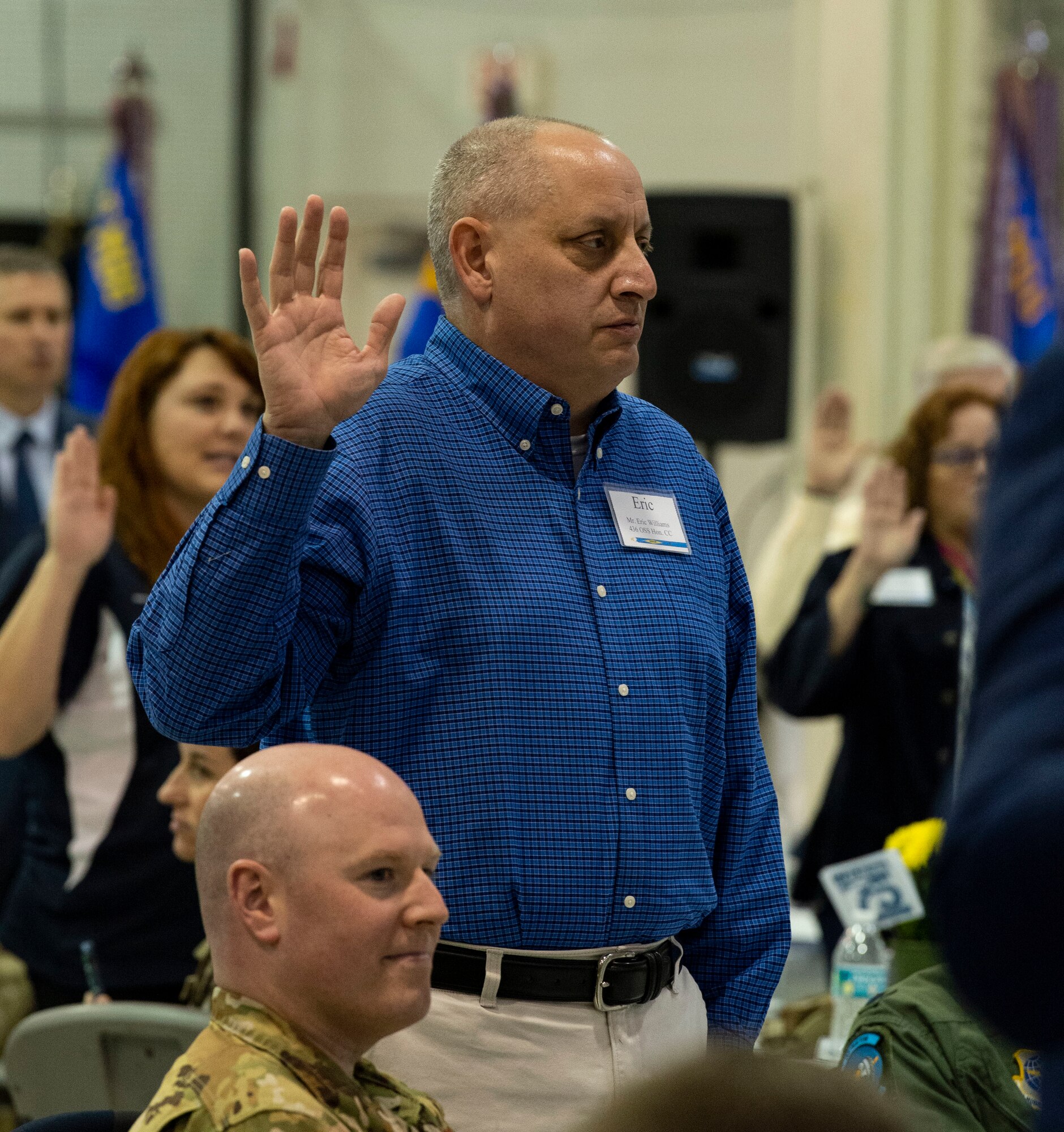 Eric Williams, 436th Operations Support Squadron honorary commander, recites the HCC Oath during the 2023 HCC Induction Ceremony at Dover Air Force Base, Delaware, Oct. 20, 2022. Forty-two local civic and business leaders were inducted into the HCC program. Williams, Delaware State Police Museum operations manager, will serve as the HCC for the 436th OSS. (U.S. Air Force photo by Roland Balik)