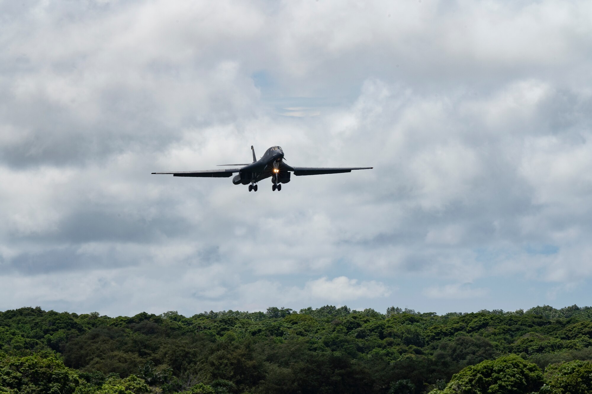 A U.S. Air Force B-1B Lancer assigned to the 37th Expeditionary Bomb Squadron, Ellsworth Air Force Base, South Dakota, prepares to land at Andersen AFB, Guam, for a Bomber Task Force mission, Oct. 18, 2022. The Lancer’s blended wing/body configuration, variable-geometry wings and turbofan afterburning engines combine to provide long range maneuverability and high speed while enhancing survivability. (U.S. Air Force photo by Staff Sgt. Hannah Malone)