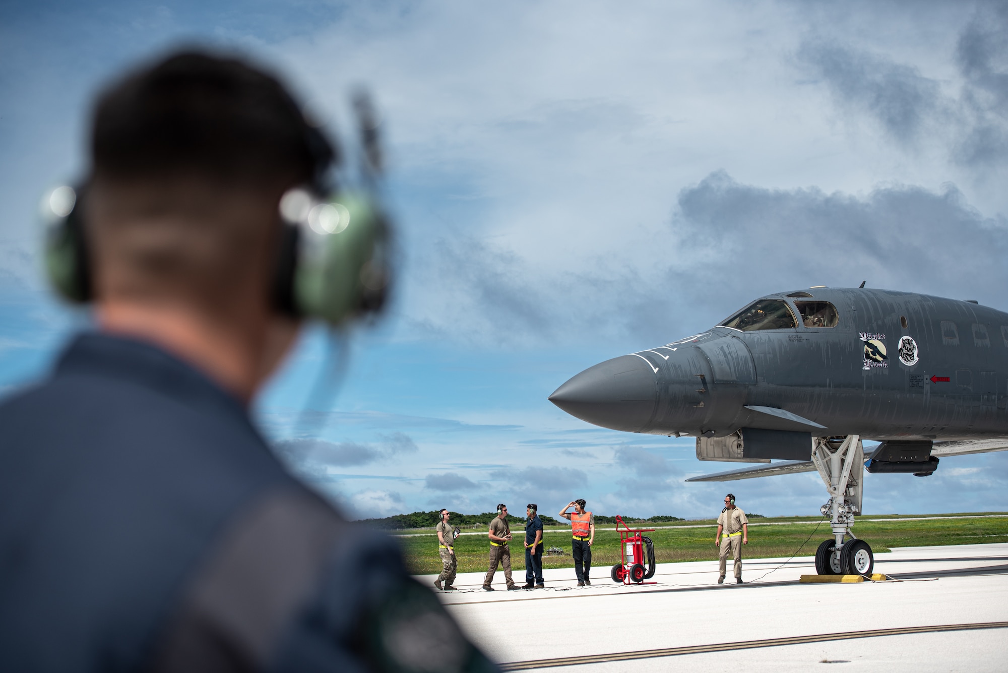 Airmen assigned to the 28th Bomb Wing recieve a U.S. Air Force B-1B Lancer assigned to the 37th Expeditionary Bomb Squadron, Ellsworth Air Force Base, South Dakota, at Andersen Air Force Base, Guam, Oct. 18, 2022. Bomber missions contribute to joint force lethality and deter aggression in the Indo-Pacific by demonstrating the U.S. Air Force’s ability to operate anywhere in the world at any time in support of the National Defense Strategy. (U.S. Air Force photo by Senior Airman Yosselin Campos)