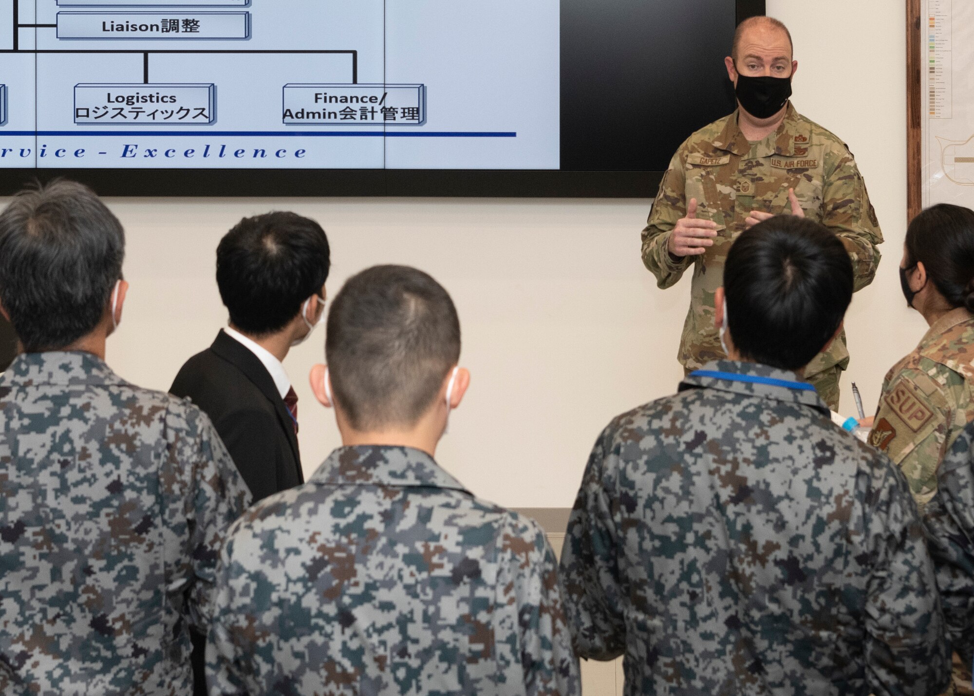 Master Sgt. Christopher Gapetz, 374th Civil Engineer Squadron readiness and emergency superintendent, briefs Japan Air Self-Defense Force civil engineer leaders during a bilateral civil engineer key leader engagement in the Emergency Operations Center at Yokota Air Force, Japan, Oct, 20, 2022.