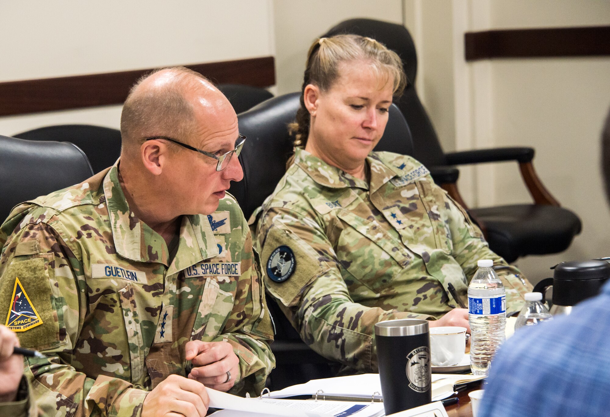 U.S. Space Force Guardians, Lt. Gen. Michael Guetlein, Space Systems Command, commander, and Maj. Gen. Deanna Burt, USSF, special assistant to the vice chief of space operations, discuss a proposal during SSC’s first Fight Tonight competition, Oct. 12, 2022. Across the command Guetlein emphasizes the need to change the way SSC does business -- from how a requisition is received, to how it is acquired, to how it is delivered…all in order to deliver more resilient space capabilities to warfighters by 2026.