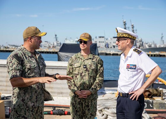 Cmdr. Carlos Otero, left, commanding officer of the Virginia-class fast-attack submarine USS New Mexico (SSN 779), speaks with Capt. Jason Pittman, center, commodore, Submarine Squadron Six, and French Vice Adm. Jacques Fayard, right, commander, Strategic and Oceanic Submarine Force, while touring New Mexico during a visit to Naval Station Norfolk, Oct. 11, 2022.