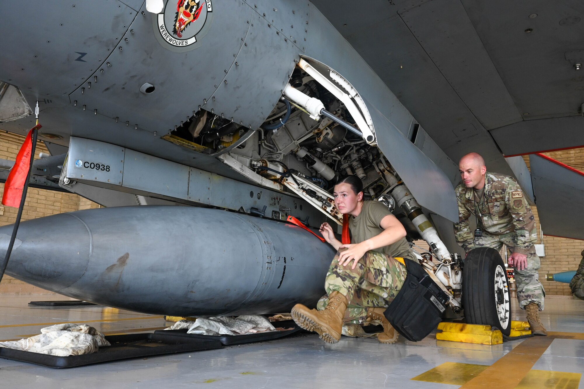 U.S. Air Force Staff Sgt. Janey Sawmiller, 309th Aircraft Maintenance Unit maintainer, inspects the landing gear well of an F-16 Fighting Falcon aircraft during a weapons load competition, Oct. 7, 2022, at Luke Air Force Base, Arizona.