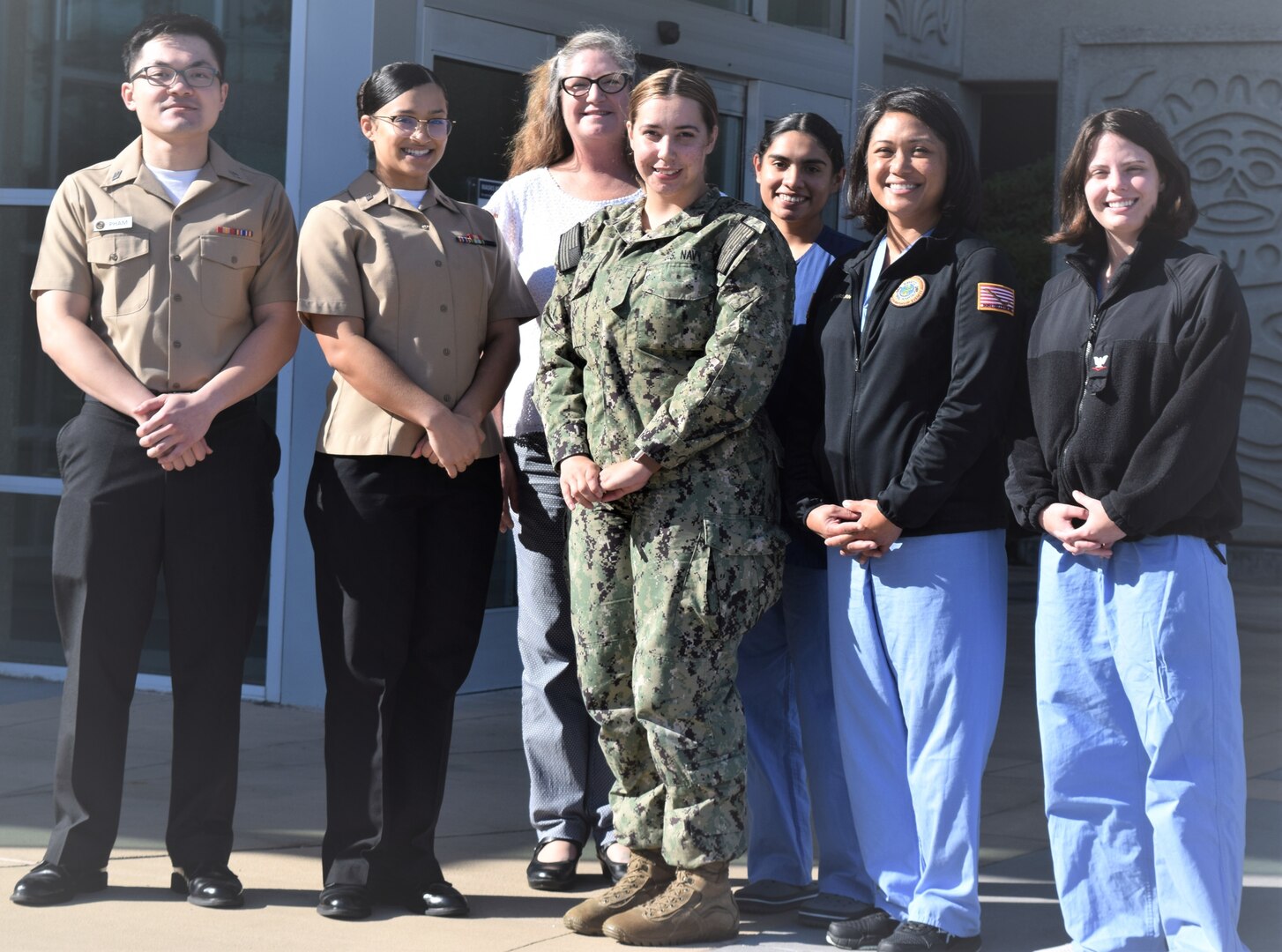 It takes a dedicated team... Elma Faye Miller, infection prevention and control nurse at Naval Hospital Bremerton (back) pauses with several of her command

department infection prevention and control liaisons before International Infection Prevention Week, Oct. 16-22, 2022, held annually to stress the importance of a culture of safety to "terminate outbreaks in health care facilities, reduce transmission of resistant organisms, and reduce overall infection rates," stressed Miller (Official Navy photo by Douglas H Stutz, NHB/NMRTC Bremerton public affairs officer)