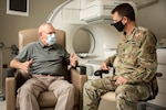 U.S. Army Lt. Col. Nathan McWhorter, chief of Nuclear Medicine, consults with his patient, retired Sgt. Maj. of the Marine Corps Harold G. Overstreet, at Brooke Army Medical Center, Joint Base San Antonio-Fort Sam Houston, Texas, on Sept. 27, 2022. They discussed a new treatment for prostate cancer patients which is combined with a specific type of positron emission tomography (PET) imaging agent for prostate cancer. (U.S. Army photo by Jason W. Edwards)