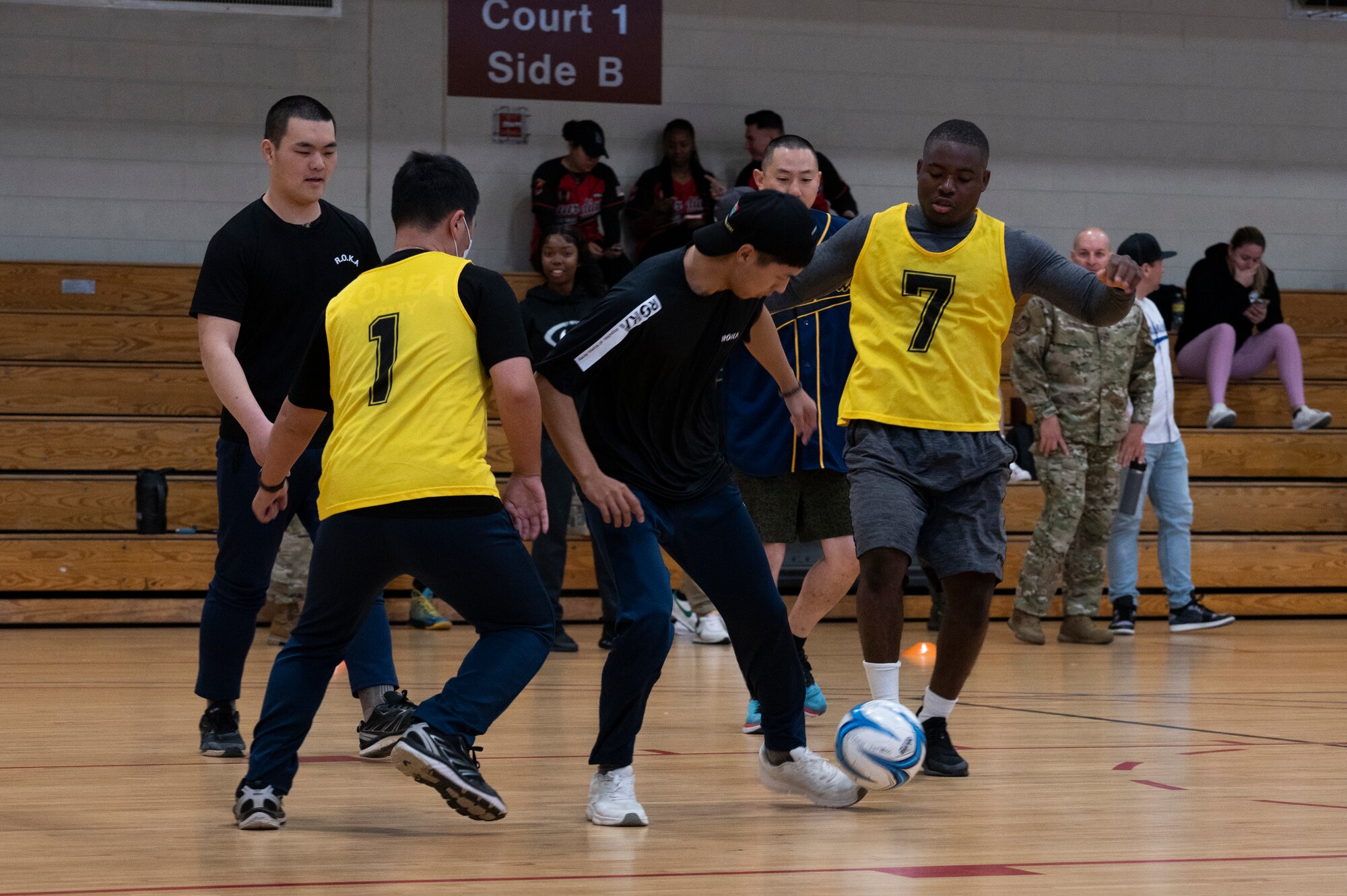 Republic of Korea and U.S. Service members fight for control of the ball during a bilateral soccer tournament at Osan Air Base, ROK, Oct. 21, 2022.