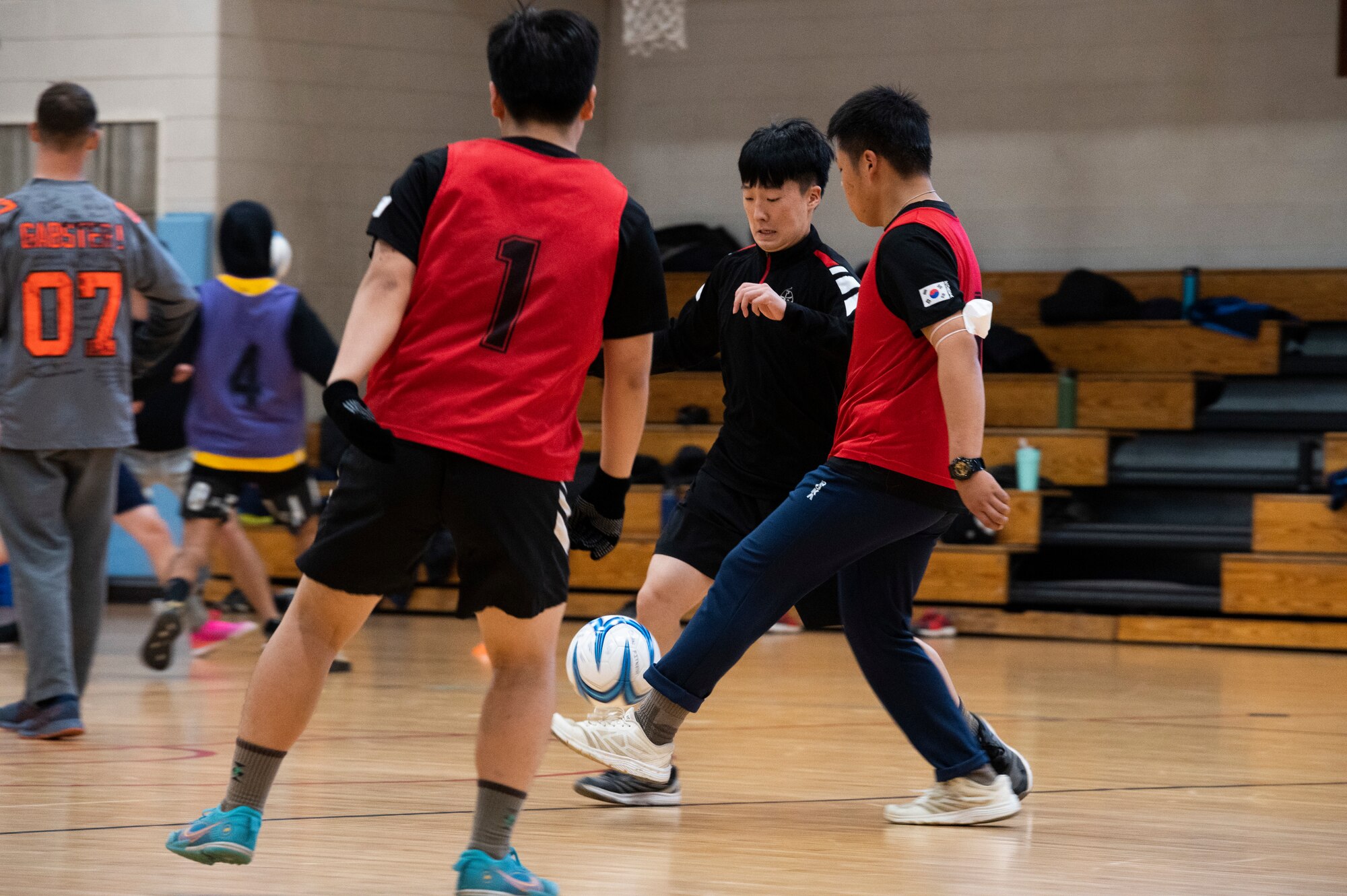 Republic of Korea service members fight for control of the ball during a bilateral soccer tournament at Osan Air Base, ROK, Oct. 21, 2022.