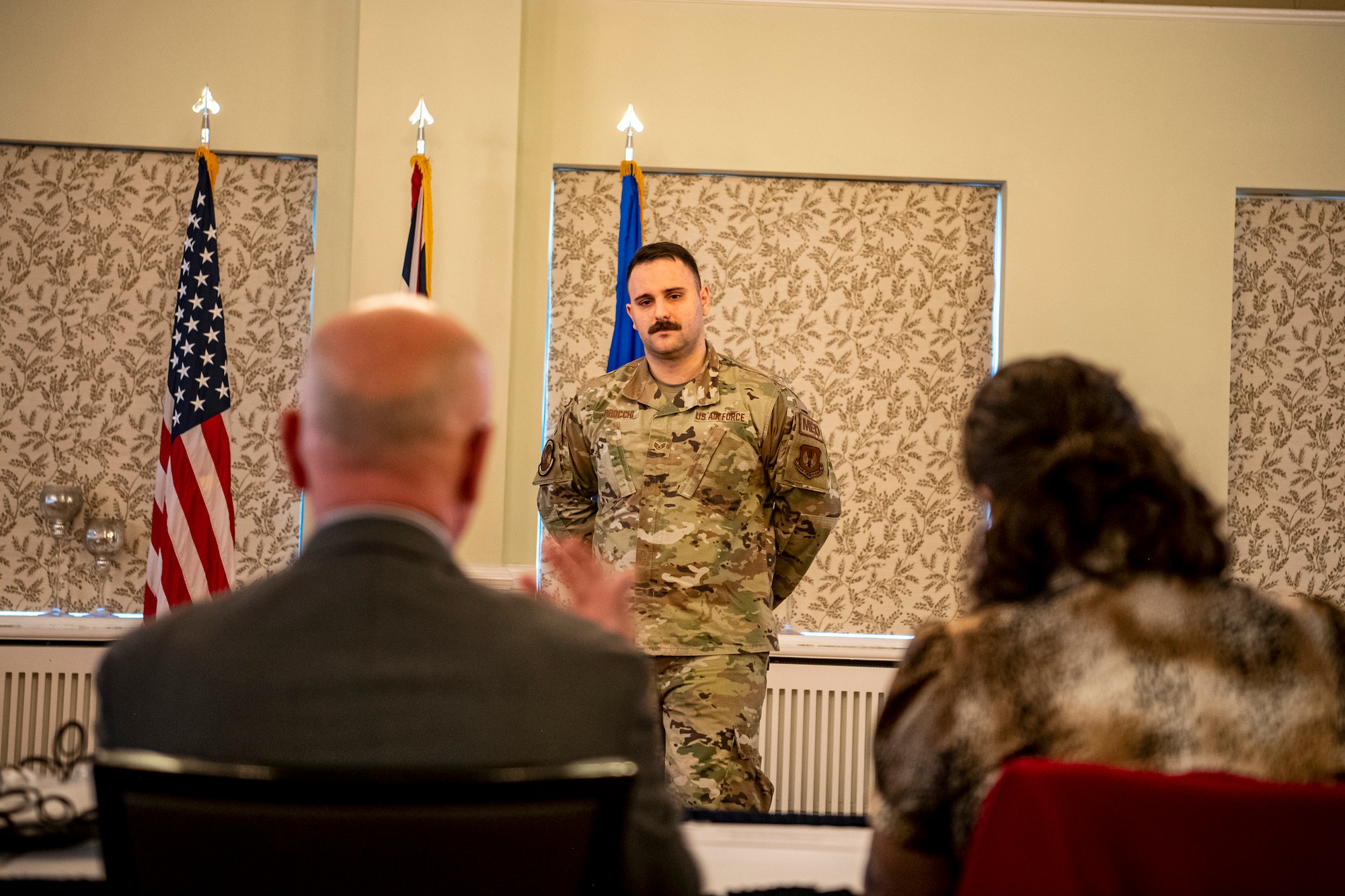 U.S. Air Force Staff Sgt. Fabio Ciarrocchi, center, 423d Medical Squadron, listens to feedback from a panel of judges during the Pathfinder Innovation Conference at RAF Alconbury, England, Oct. 21, 2022. The conference gave participants an opportunity to pitch their innovations, which were evaluated by a panel of judges and ranked based on their feasibility and overall benefit to the 501st Combat Support Wing mission. (U.S Air Force photo by Staff Sgt. Eugene Oliver)