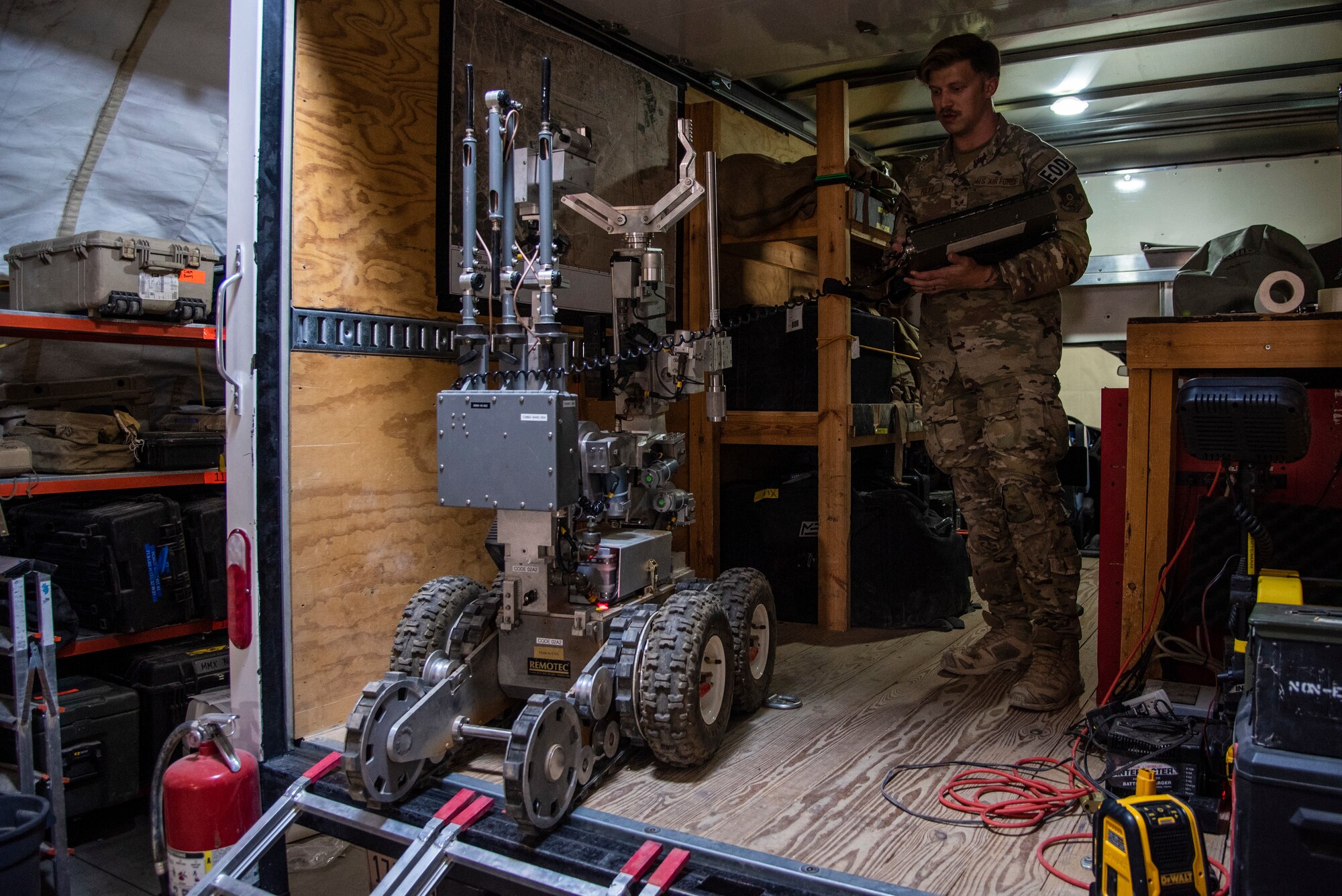 Senior Airman Kyle Riley, 332d Expeditionary Civil Engineering Squadron Explosive Ordnance Disposal Logistics Technician, operates an Andros F6A remotely-controlled robot at an undisclosed location in Southwest Asia, Oct. 14, 2022. Riley was instrumental in arranging repairs for this and other EOD tools, enhancing his unit's ability to respond to explosive threats. (U.S. Air Force photo by: Tech. Sgt. Jim Bentley)