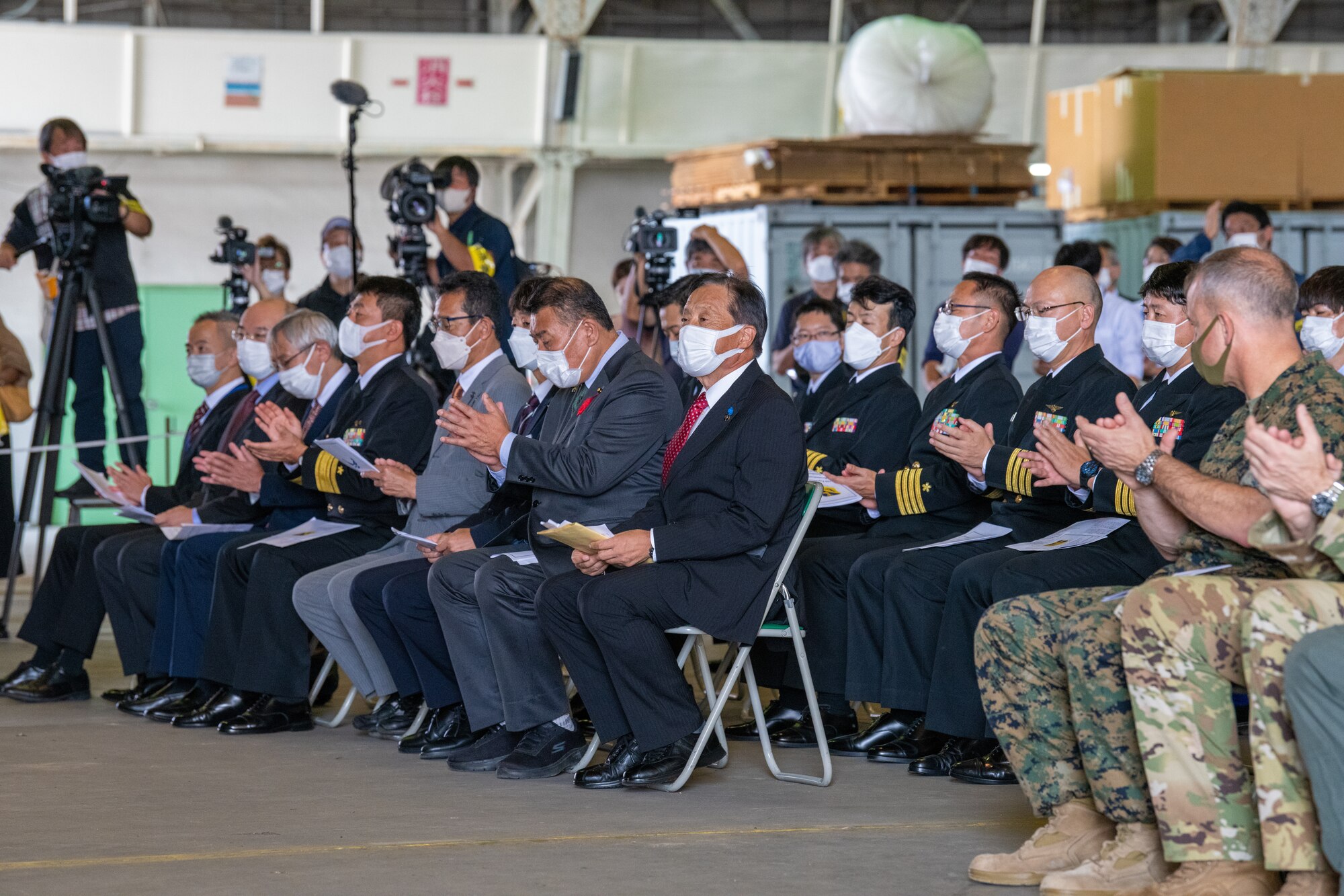 Attendees applaud from seats