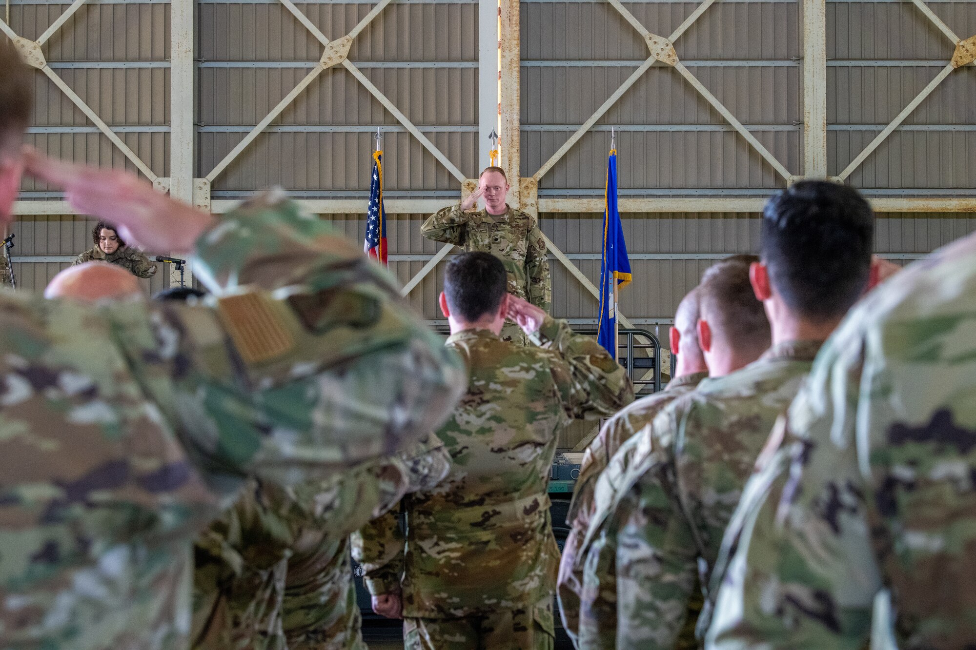 Commander returns salute to formation