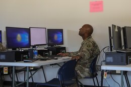 A Soldier uses a computer in training