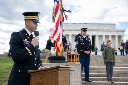 U.S. Army 3rd Infantry Regiment ‘The Old Guard’ Capt. Zachary Moss addresses the crowd as emcee of the Joint Services Drill Exhibition Oct. 19, 2022, at the Lincoln Memorial Plaza, Washington, D.C. This was the first Joint Services Drill Exhibition in ten years. (U.S. Air Force photo by Jason Treffry)