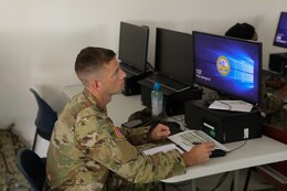 A Soldier uses a computer