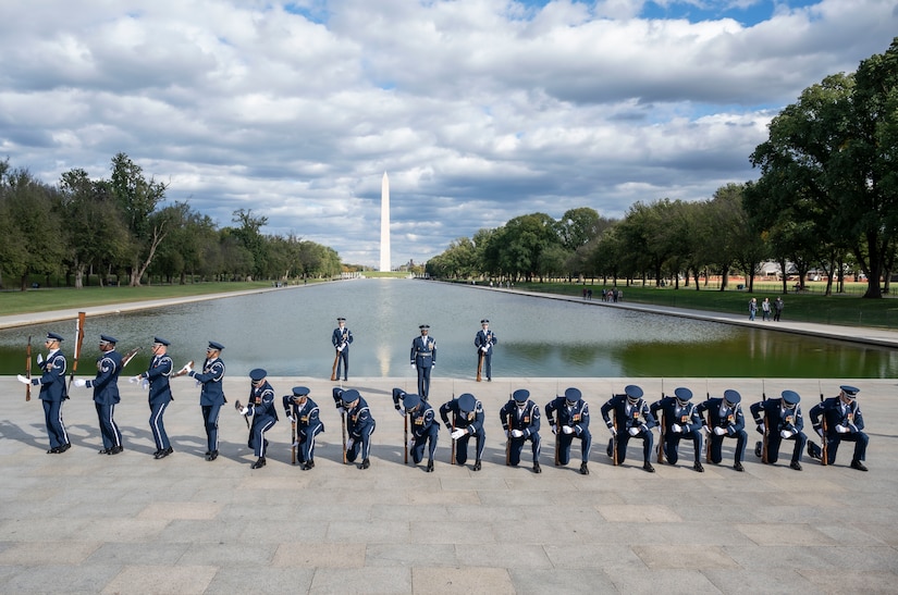 The United States Air Force Honor Guard Drill Team performs their routine during the Joint Services Drill Exhibition Oct. 19, 2022, at the Lincoln Memorial Plaza, Washington, D.C. During this exhibition, teams compete for the most superlative display of precision, mastery, discipline and teamwork as they undertake simultaneous ceremonial maneuvers. (U.S. Air Force photo by Jason Treffry)