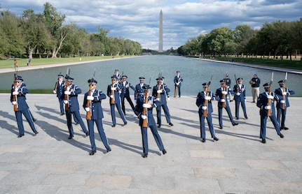 The United States Air Force Honor Guard Drill Team performs their routine during the Joint Services Drill Exhibition Oct. 19, 2022, at the Lincoln Memorial Plaza, Washington, D.C. During this exhibition, teams compete for the most superlative display of precision, mastery, discipline and teamwork as they undertake simultaneous ceremonial maneuvers. (U.S. Air Force photo by Jason Treffry)